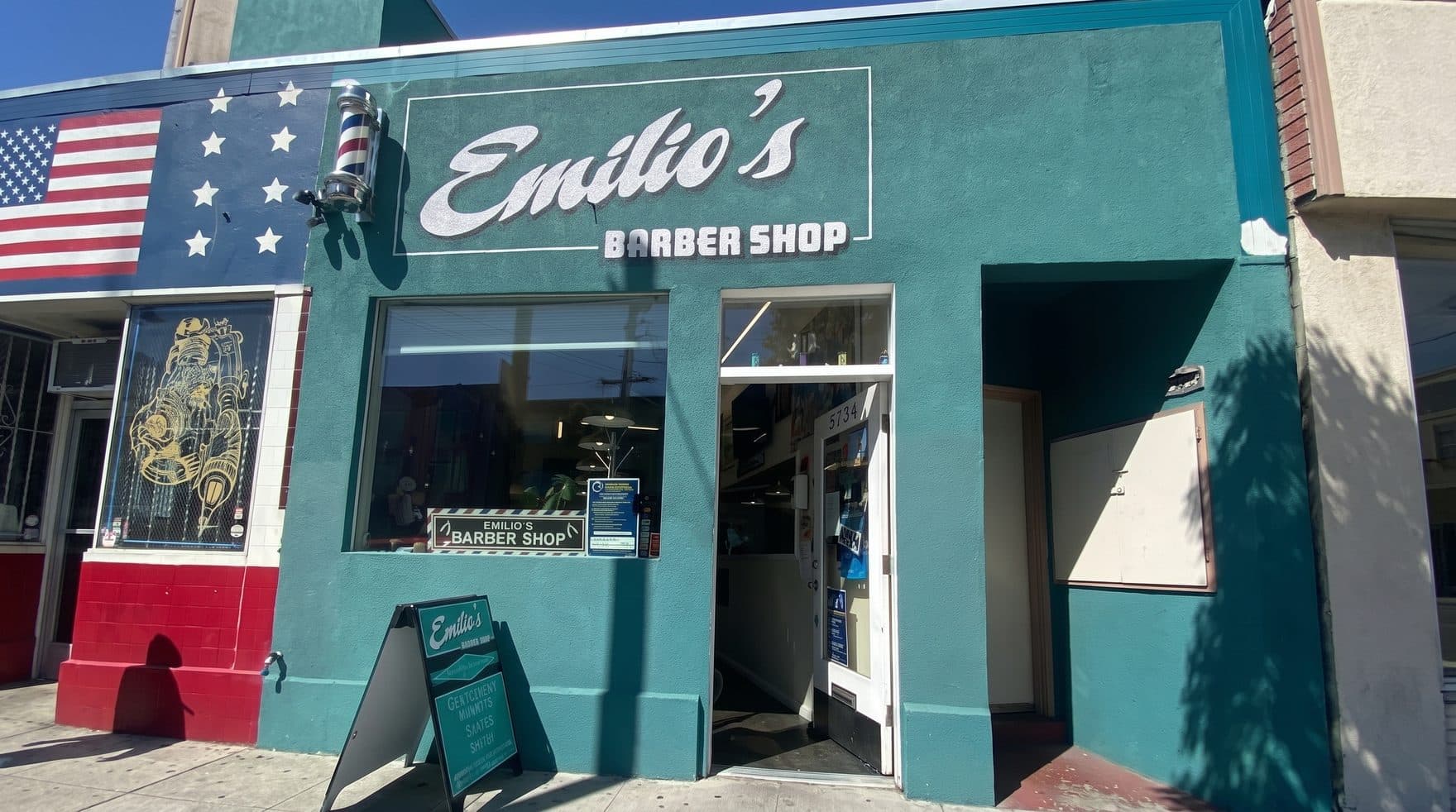 Emilio's Barber Shop — the Mission Street storefront at dusk, neon lit